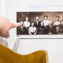 UW-Madison graduate student Larissa Cangussu points out a historical family photo as she talks about a music cabinet display she helped research.