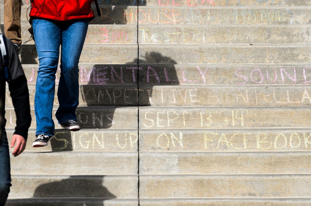 Photo: Close-up of event notice chalked into steps