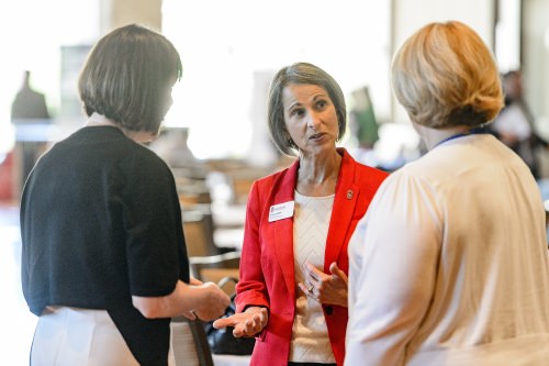 Photo: Susan LaBelle talking with 2 unidentified women