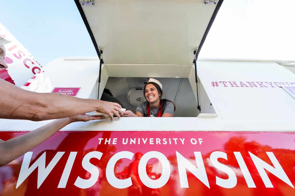 WFAA marketing coordinator Julia Kinsey serves scoops of ice cream from the 