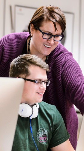 Photo: Ahna Skop with student at computer