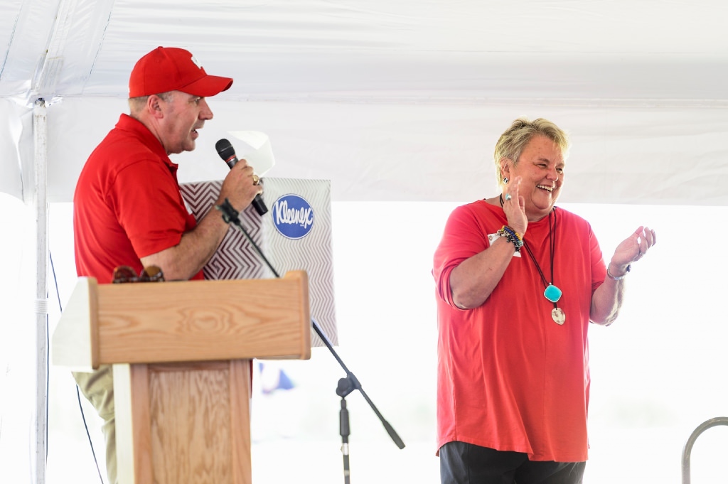 Paula Bonner, retiring executive director of the Wisconsin Alumni Association, laughs as Jeff Wendorf, WFAA vice president of advancement for alumni relations and engagement, presents her with a giant tissue box as Bonner — known for periodically becoming overcome with emotion — is honored during the Wisconsin Foundation and Alumni Association's annual staff picnic.