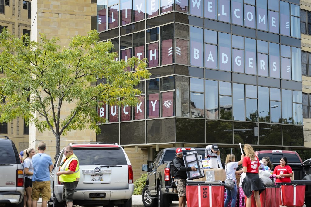 Photo: People filling a bin with boxes