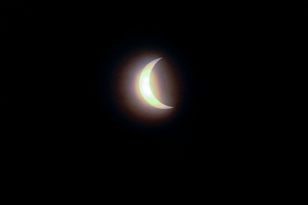 The moon passes orbit in front of the sun for a maximum 85-percent solar eclipse -- as seen at the Library Mall at the University of Wisconsin-Madison -- on Aug. 21, 2017. A total-solar eclipse was visible, for the first time in almost 100 years, along a coast-to-coast path across the middle of the United States from Oregon to the Carolinas. (Photo by Jeff Miller / UW-Madison)