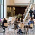 A photo of people relaxing in an atrium.