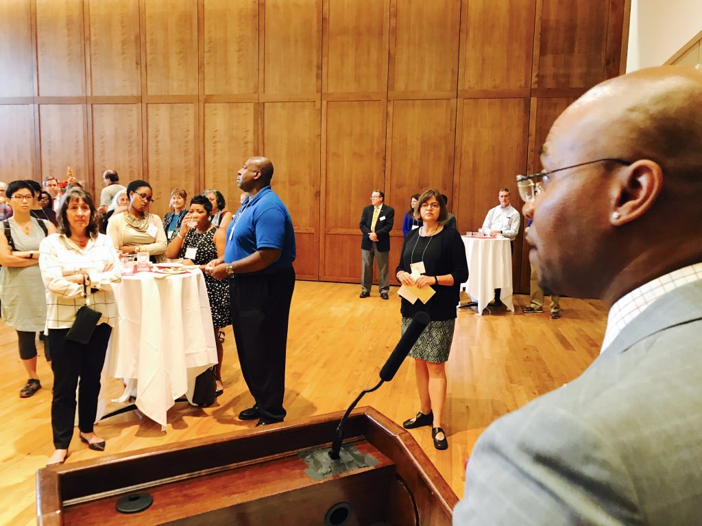 Patrick Sims, vice provost and chief diversity officer, addresses about 100 people at the Faculty of Color reception Monday at Union South. 