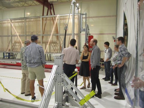 Photo: Group of people looking at equipment being built inside the Physical Sciences Lab