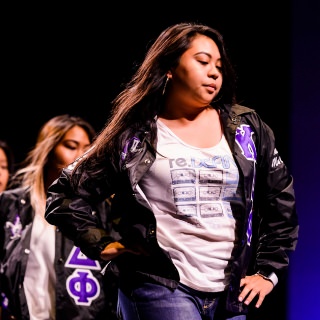 Student members of alpha Kappa Delta Phi International Sorority, Inc. -- part of the Multicultural Greek Council (MGC ) -- stroll and salute during the Multicultural Orientation and Reception (MCOR) at the Wisconsin Union Theater's Shannon Hall at the University of Wisconsin-Madison on September 6, 2017. MCOR is part of a series of beginning-of-the-semester Wisconsin Welcome events. (Photo by Jeff Miller / UW-Madison)