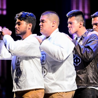 Student members of Lambda Theta Phi Latin Fraternity, Inc. -- part of the Multicultural Greek Council (MGC ) -- stroll and salute during the Multicultural Orientation and Reception (MCOR) at the Wisconsin Union Theater's Shannon Hall at the University of Wisconsin-Madison on September 6, 2017. MCOR is part of a series of beginning-of-the-semester Wisconsin Welcome events. (Photo by Jeff Miller / UW-Madison)