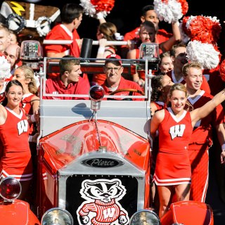 Members of the UW Spirit Squad and the Bucky Wagon make their way down the tunnel just before the start of the UW Homecoming football games versus Maryland inside Camp Randall Stadium at the University of Wisconsin-Madison on Oct. 21, 2017. The Badgers won the game 38-13. (Photo by Bryce Richter / UW-Madison)