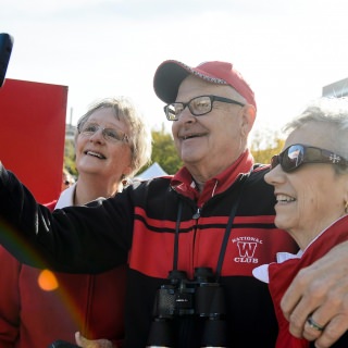 Badger fans Judy Anderson, Tom Arzner and Laurie Juno show take a selfie during the Badgerville pregame event prior to the UW Homecoming football games versus Maryland inside Camp Randall Stadium at the University of Wisconsin-Madison on Oct. 21, 2017. The Badgers won the game 38-13. (Photo by Bryce Richter / UW-Madison)