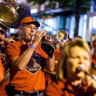 Members of UW-Madison's Alumni Band performs before thousands of spectators lining State Street during the University of Wisconsin-Madison's Homecoming Parade on Oct. 20, 2017. The annual parade is one of many Homecoming week activities sponsored by the Wisconsin Alumni Association (WAA). (Photo by Jeff Miller / UW-Madison)