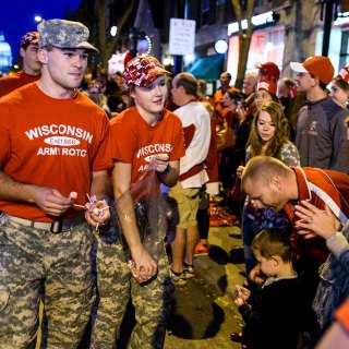 Members of UW-Madison's Army-ROTC hand out candy as thousands of spectators and children line State Street during the University of Wisconsin-Madison's Homecoming Parade on Oct. 20, 2017. The annual parade is one of many Homecoming week activities sponsored by the Wisconsin Alumni Association (WAA). (Photo by Jeff Miller / UW-Madison)