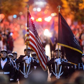 Members of the UW Honor Guard make their way down State Street during the annual Homecoming Parade at the University of Wisconsin-Madison on Oct. 20, 2017. (Photo by Bryce Richter / UW-Madison)