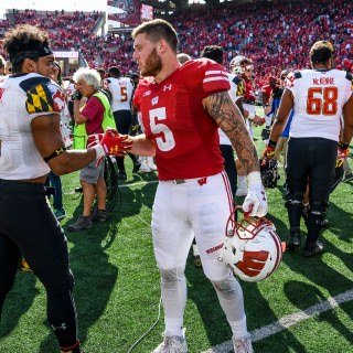 Following a hard-fought game, Maryland player Ty Johnson (6) and Wisconsin running back Chris James (5) share a lighter moment on the field after the Wisconsin Badgers beat the Maryland Terrapins during a UW Homecoming football game at Camp Randall Stadium at the University of Wisconsin-Madison on Oct. 21, 2017. Wisconsin won, 38-13. (Photo by Jeff Miller / UW-Madison)