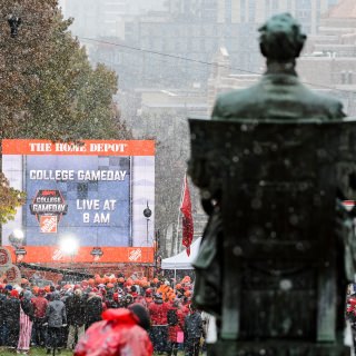 Photo of Abraham Lincoln statue with crowd in background.