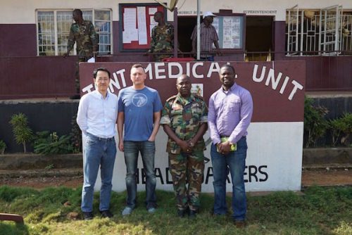 Photo: Team standing in front of military hospital