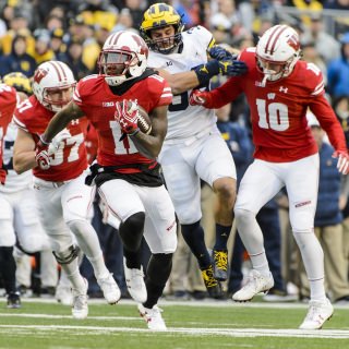 Photo of cornerback Nick Nelson (11) returning a punt for a touchdown.