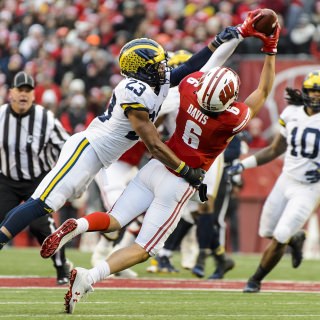 Photo of wide receiver Danny Davis (6) going up for a pass.