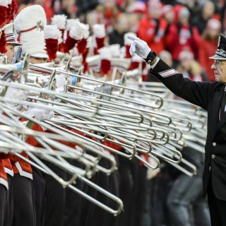 Photo of director Mike Leckrone leading the band.