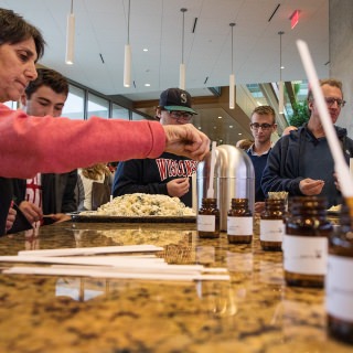 Ruth Steinberg, left participates the Life of Cheese: A Tasting and Science of Cheese event with her family at Discovery Building's Steenbock's on Orchard Restaurant in Madison, WI. Saturday, Nov. 4, 2017. Steinberg is from the Bay Area of California, and her son, Benjamin Strehlow, second from left, is a freshman of UW-Madison and studies political science. (Photo by Hyunsoo Léo Kim | University Communications)