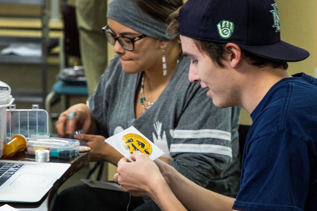 Using symbols from the Red Cliff Band of Lake Superior Chippewa as his pattern, Wunk Sheek member Collin Ludwig begins his Native American beadwork. To celebrate Native American Heritage Month, student group Wunk Sheek hosted a bead workshop designed to teach contemporary Native American styles at Chadbourne Residence Hall at the University of WisconsinÐMadison in Madison, WI on Tuesday, November 14, 2017. (Photo by Nate Moll | University Communications)