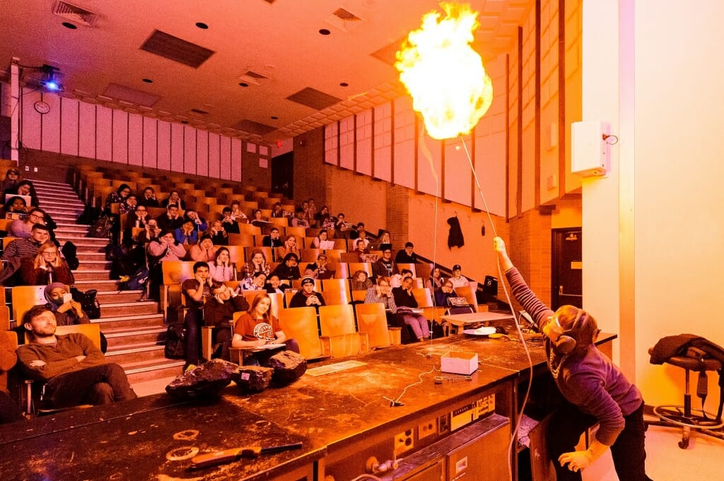 Photo: Students watching flames shooting from balloon