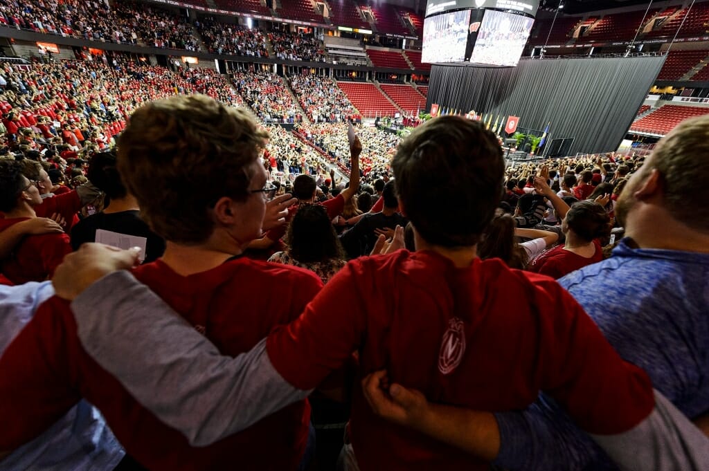 Photo: Students arm-in-arm in convocation crowd