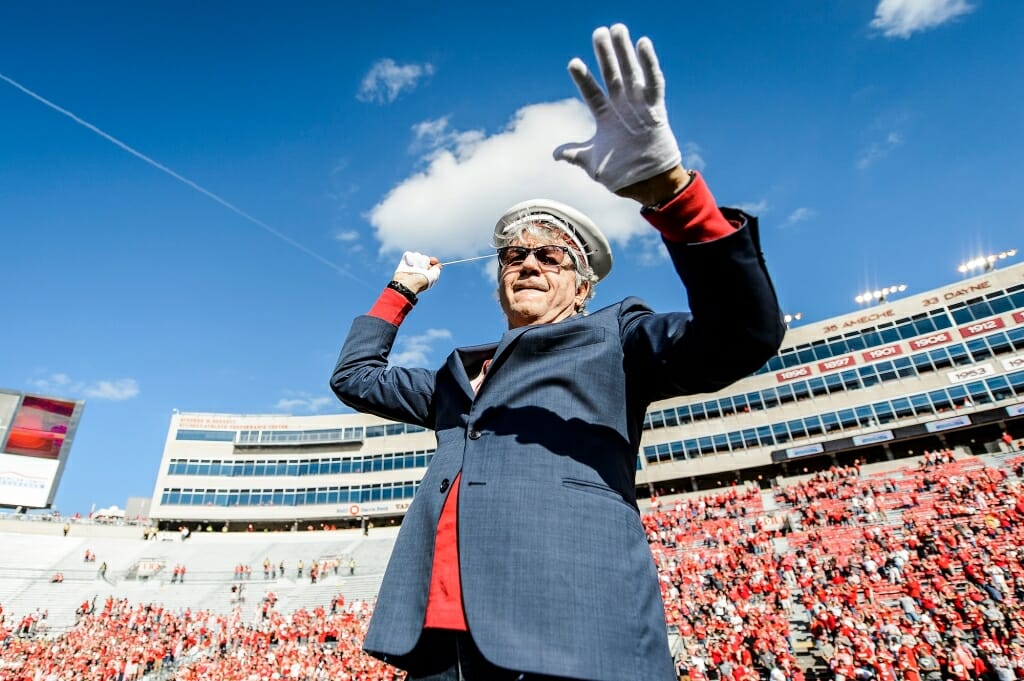 Photo: Steve Miller with baton, wearing white gloves and director's hat