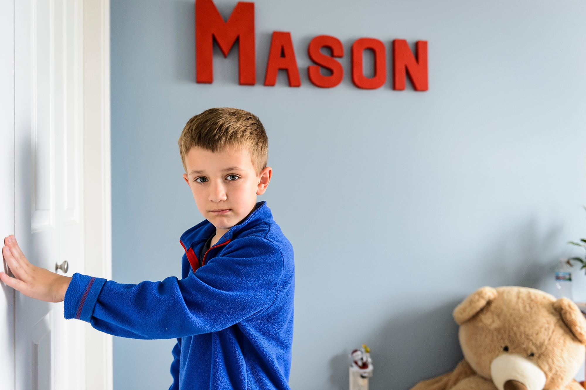 Mason Konsitzke, 7, plays in his bedroom at home in Stoughton.