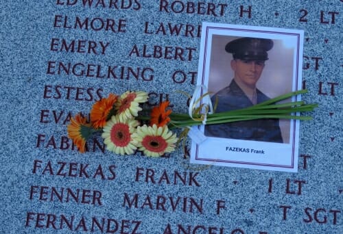 Photo: Photo of Fazekas in uniform on top of memorial with his name carved in it