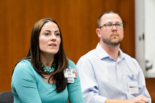 A photo of Lindsay and Ryan Geier at a panel discussion about NF1. Their daughter has the disease.