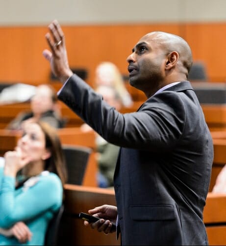 Dhanansayan "Dhanu" Shanmuganayagam gestures while he speaks about his NF1 research at a symposium for patients and families at UW–Madison in May.