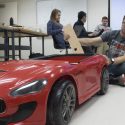 UW-Madison freshman James Charapata, working on a mechanism to allow a parent to steer this car for a child with disabilities, says, “We proved to ourselves we were not crazy, are on a good path, and once we can make it without duct tape…” The freshman design course at the UW-Madison College of Engineering offers satisfaction, he adds: “ I love making people feel like they have control of their world. I have a couple of family members who are less fortunate, and I have seen their faces light up when I was able to help.”
