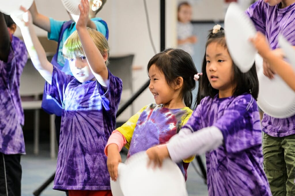 Photo: Children in purple tie-dyed t-shirts