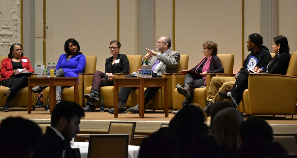 Photo: Luis Pinero speaking as part of panel of guests