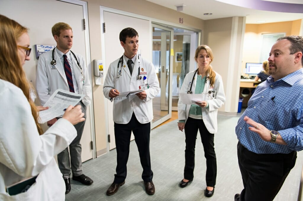 Photo: Josh Medow talking to medical students in ICU