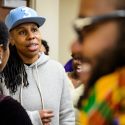 Photo of people speaking to one another at an event reception