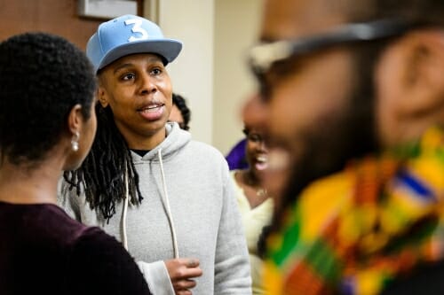 Photo of people speaking to one another at an event reception