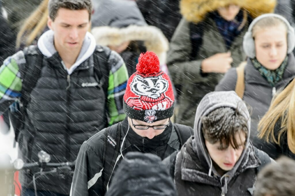 Bundled up pedestrians make their way around campus.