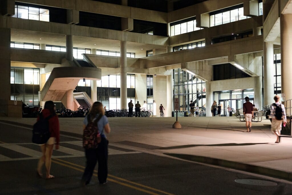 Photo: Pedestrians cross Observatory drive as they walk toward College Library in Helen C. White Hall.