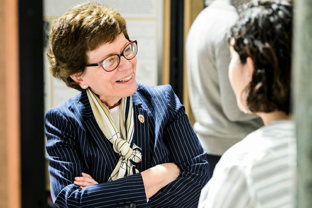 UW-Madison Chancellor Rebecca Blank listens to student Liliana Lule talk about her research project.