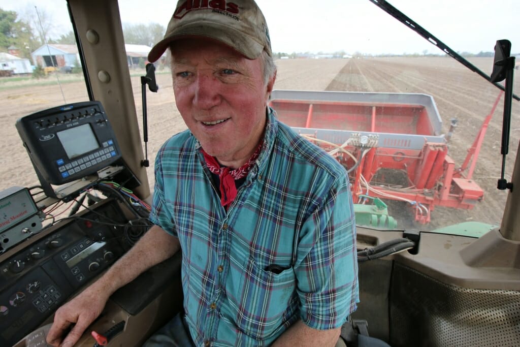 Photo: Justin Isherwood sitting in cab of tractor