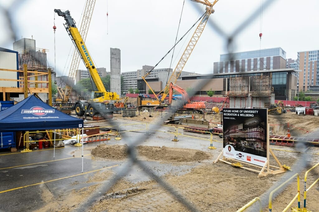 Rain soaks the construction site. The event was instead held in the lobby of the adjacent LaBahn Arena.