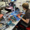 Lead engineer Daniel Seemuth tests electronics for the OnLume system, which works while normal surgical lights remain lit.