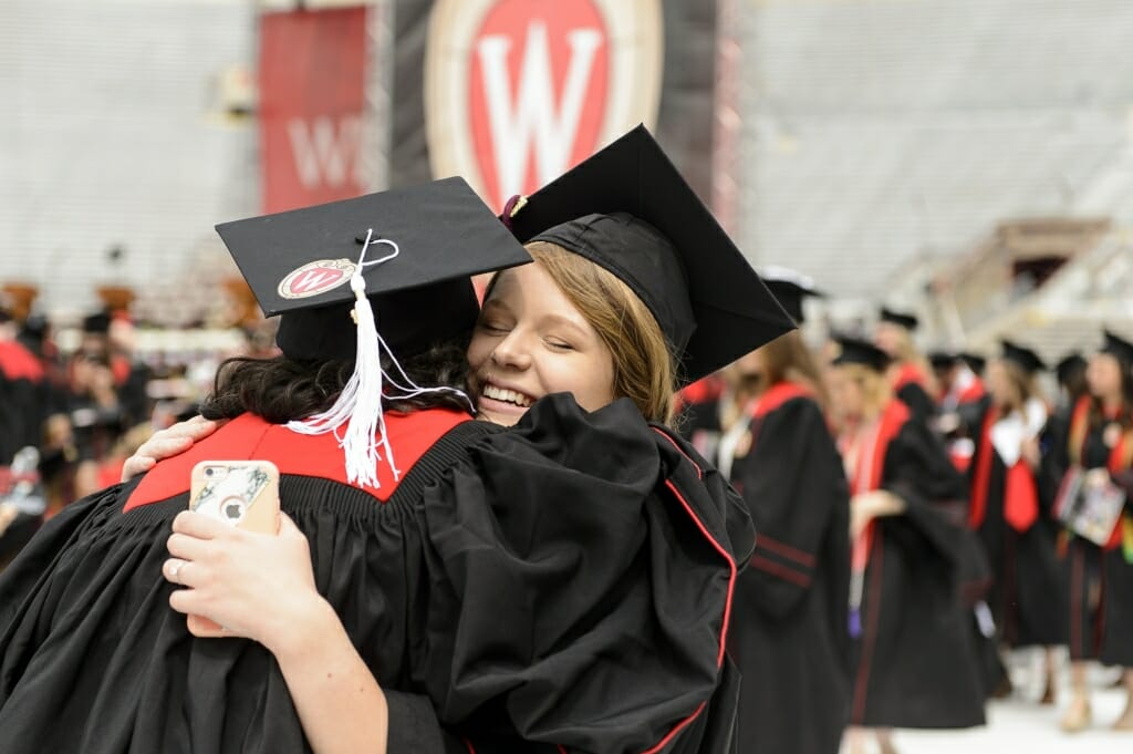 Photo of Miah Gatzke embracing a friend before the ceremony.