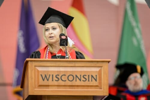 Photo of Ariela Rivkin, senior class president, addressing the graduates.