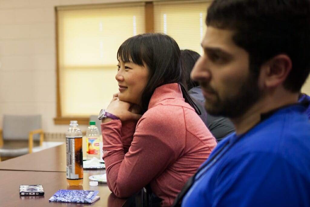 Photo: Smiling woman sitting at table