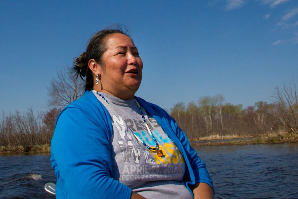 Photo: Edith Leoso sitting near the water