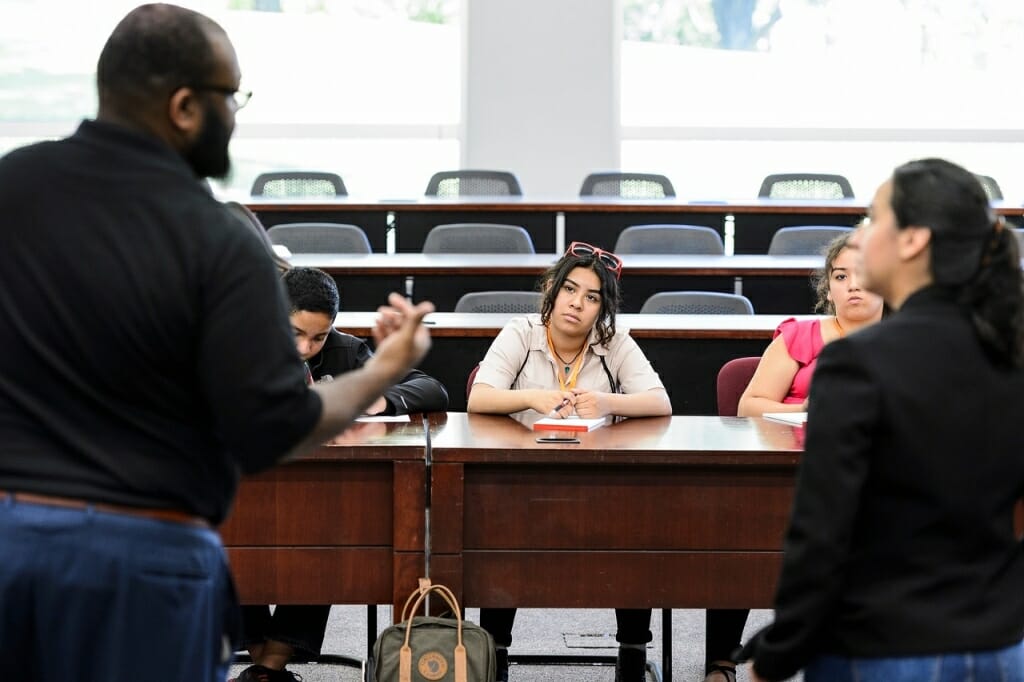 Photo: Sir Williams talking to group of students